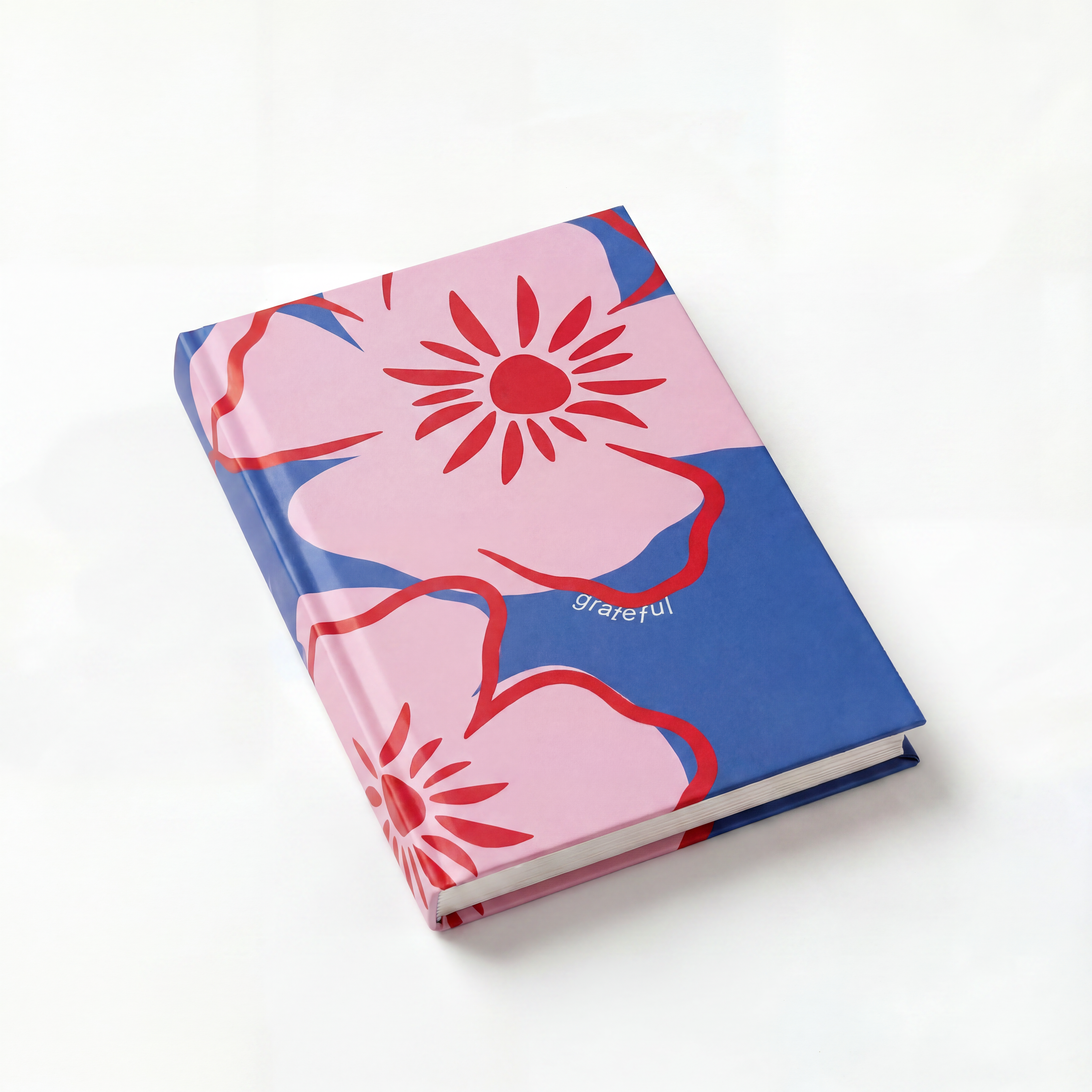 Notebook with pink floral design on a white background