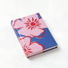 Notebook with pink floral design on a white background