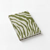 Notebook with green and white zebra pattern on a white background