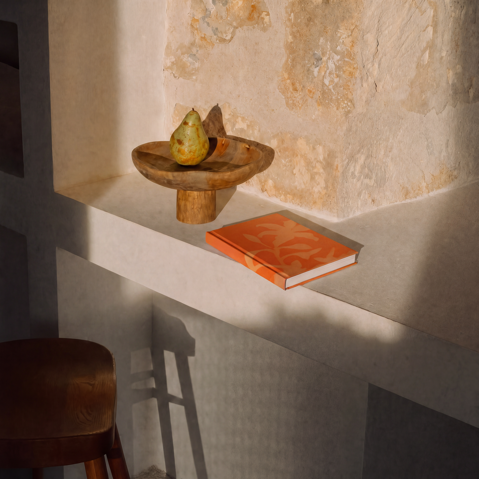 flatlay of an orange journal with a pear 