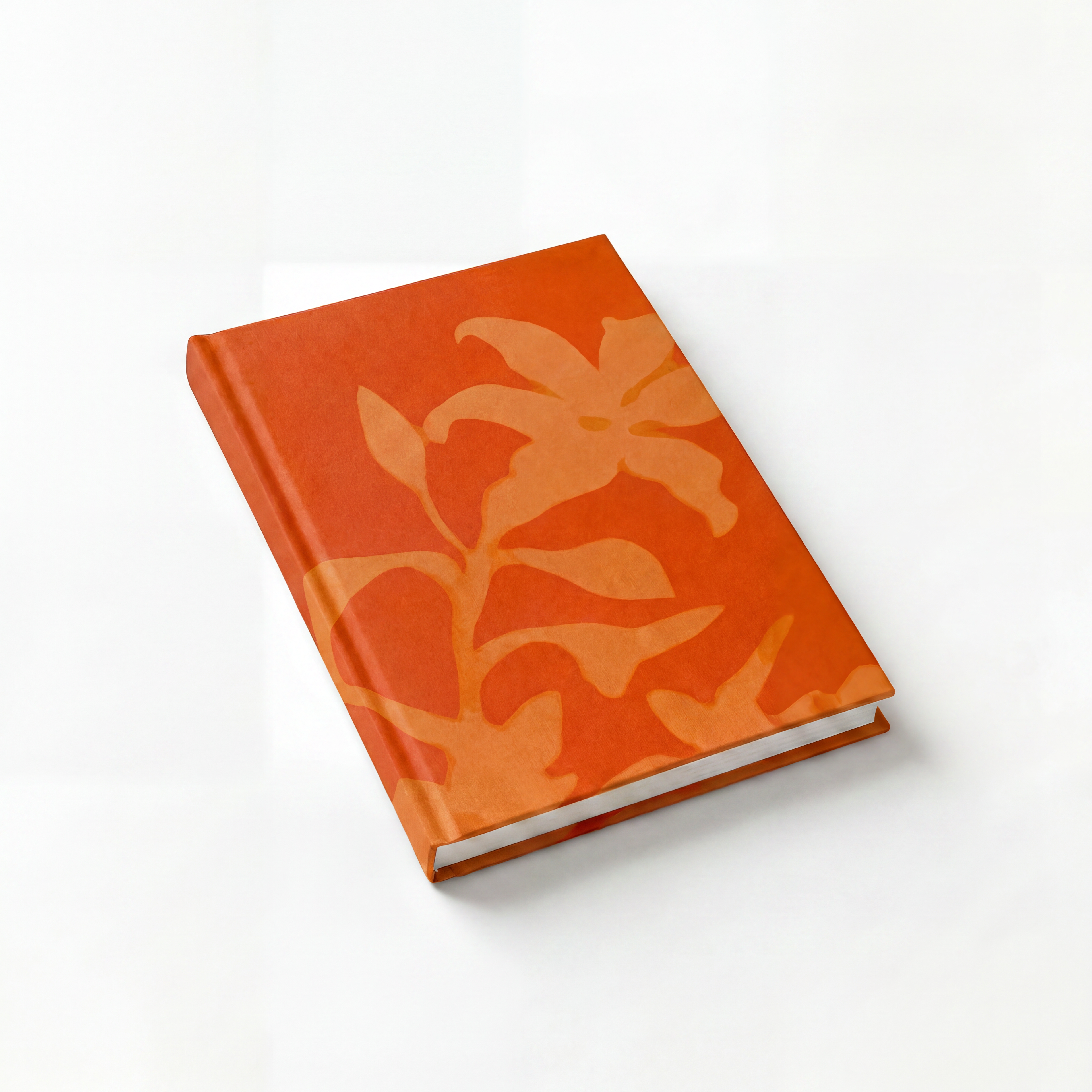 Orange floral pattern journal on a white background